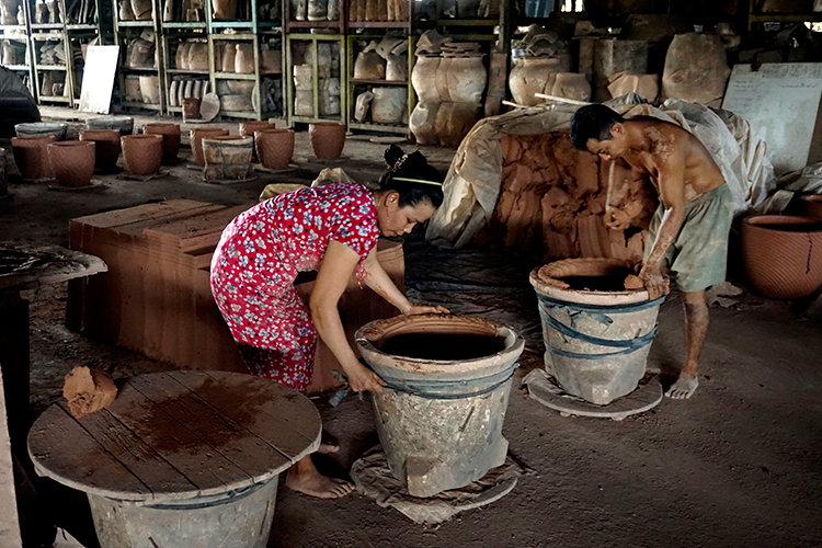 Pressing clay into mould