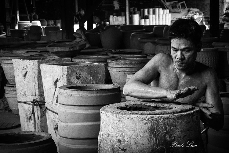 Pressing clay into mould